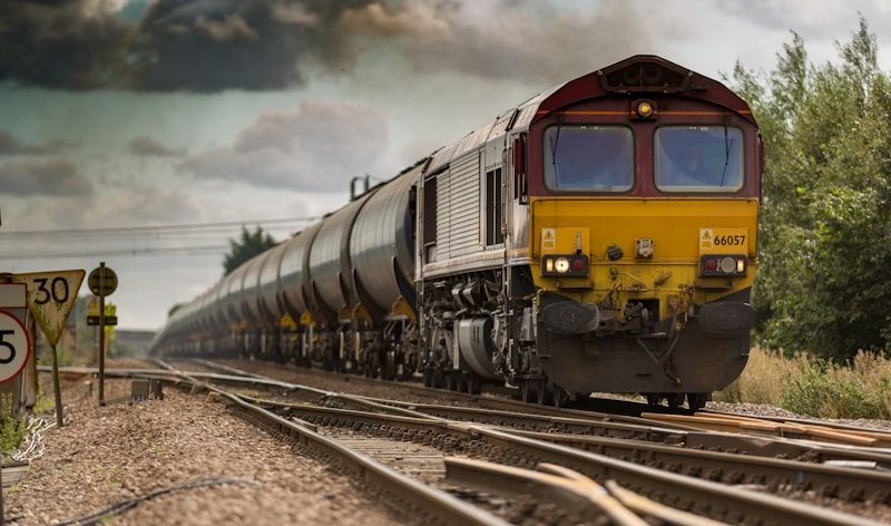 High-horsepower locomotives pulling heavy multi-wagon consists.